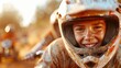 © LifeMedia - This image showcases a close-up view of a motocross racer wearing full gear, navigating the track with speed and determination under the bright sunlight.