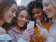 © Alexander Chaykin - Group of women viewing smartphone together, possibly discussing or sharing content