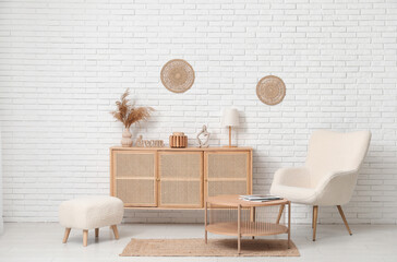 Wall Mural - Modern chest of drawers with decor, armchair, coffee table and pouf in room