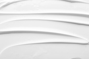texture of face care cream as background, top view