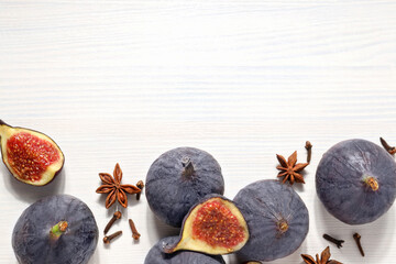 Wall Mural - Fresh ripe figs on a white background