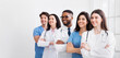 © Prostock-studio - Diverse team of doctors posing in hospital, headed by main practitioner