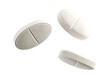 © Yeti Studio - Three white pills floating in the air, cut out
