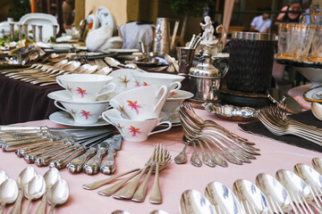 Cutlery for sale on stall at the flea market in Arezzo Italy