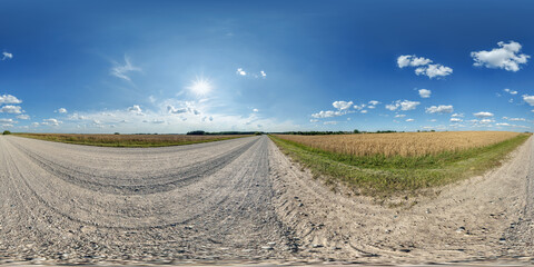 Wall Mural - hdri 360 panorama of blue sky with awesome clouds on roadside of gravel road among fields in equirectangular full seamless spherical projection, for VR AR content or skydome replacement