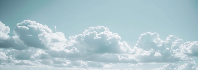 Wall Mural - Fluffy White Clouds in a Blue Sky