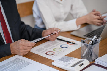 Wall Mural - Financial inspector calculating a numbers in office room..