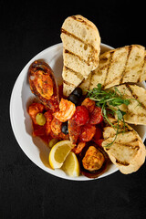 Wall Mural - Gourmet Seafood Saute in Tomato Sauce with Grilled Ciabatta