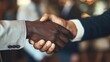 © furyon - powerful business handshake closeup on clasped hands contrasting skin tones professional attire visible symbolizing partnership and agreement