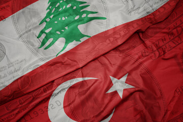 Sticker - waving colorful flag of lebanon and national flag of turkey on the dollar money background. finance concept.