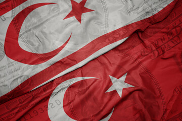 Sticker - waving colorful flag of northern cyprus and national flag of turkey on the dollar money background. finance concept.