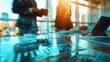 © nuttapong - Business people discussing over a glass table with a cityscape reflection.  The image suggests collaboration, innovation, and success.