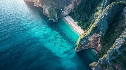 An aerial view of a stunning nature background featuring an azure beach with rocky mountains and clear blue water, showcasing the vibrant and bright colors of the Thailand ocean on a sunny day.