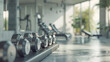 © Hound - Dumbbells and gym equipment in a fitness club or sports center with a blurred background of a modern sports warehouse