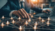 © Chatchanan - Businessman strategizing customer engagement using CRM tools, network technology visuals