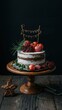 © Nemanja - A cake with a white frosting and a red ribbon on top