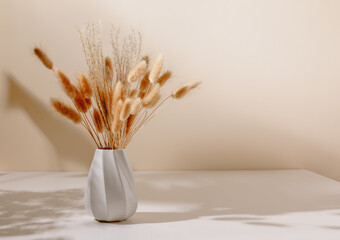 Wall Mural - Stylish vase with pampas and lagurus grass bouquet on the table, copy space for product presentation. Home interior decoration