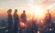 © sornram - Silhouettes of business people against a city skyline at sunset, symbolizing teamwork, collaboration, and corporate success.