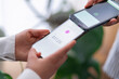 © Studio Marmellata - Two people engage in a digital payment transaction using their mobile phones The phones are close together, highlighting the ease of electronic transactions