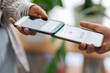 © Studio Marmellata - Two people engage in a digital payment transaction using their mobile phones The phones are close together, highlighting the ease of electronic transactions