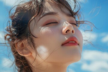 Wall Mural - Under the blue sky and white clouds, a Japanese and Korean girl looks at the close-up of the sun on the beach, with exquisite makeup and Japanese style
​