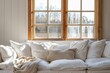 © Igor - Interior design of living room with white sofa, pillows and window