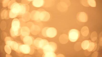 Wall Mural - Abstract Blurred video screensaver bokeh golden sea at sunset. The sun reflects and sparkles on the waves.