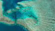 © AmazingAerialAgency - Aerial view of tropical island with reef and ocean, Fiji.