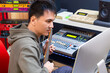 © princeoflove - asian male musician playing electric guitar for recording in home studio