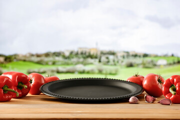 Wall Mural - Summer wooden table with copy space for food and products. Tuscany countryside fields background.