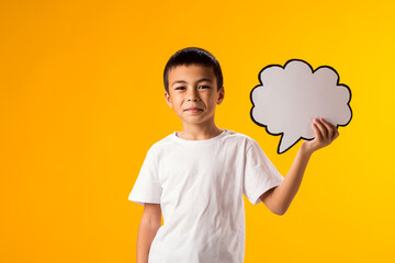 Child boy holding think cloud bubble card. Dreaming and idea concept