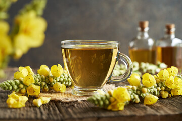 Wall Mural - Mullein or Verbascum tea in a transparent glass cup