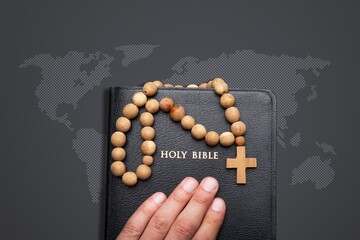 Sticker - Hand holding Bible book and world map