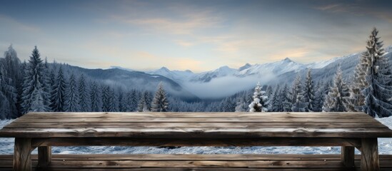 Poster - old wooden table covered in snow with snow fir trees in the background