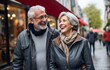 © QuietWord - Happy senior couple talking walking on street