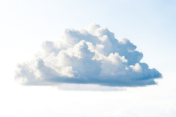 Sticker - Fluffy White Cloud Isolated on a Blue Sky Background