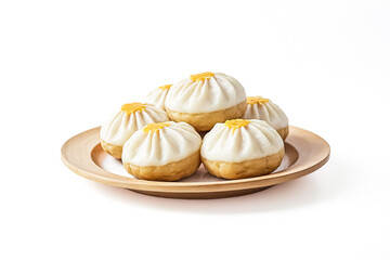 Wall Mural - Steamed buns with a yellow filling on a wooden plate