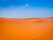 © Audrius - Sand dunes in the Sahara desert with blue sky in background, Merzouga, Morocco, North Africa