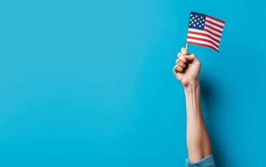 Hand Raising American Flag on Blue Background