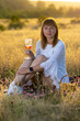 © Олег Мальшаков - Beautiful young girl with a glass of wine on a picnic