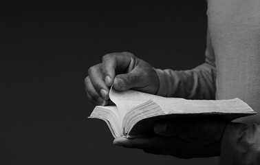 Wall Mural - praying to god with hands together praying with black background with people stock image stock photo