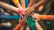 © Dinara - A group of diverse people with painted hands holding hands together, symbolizing unity and teamwork.