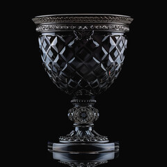 Wall Mural - Exquisitely detailed crystal chalice with ornate patterns on a dark background.
