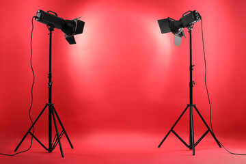 Wall Mural - Red photo background and professional lighting equipment in studio