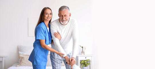 Poster - Female caregiver helping senior man with walking stick in bedroom