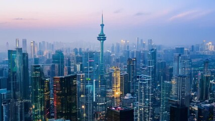 Wall Mural - A city skyline with a tall tower in the middle. The sky is cloudy and the city is lit up at night