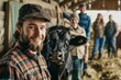 © VolumeThings - Contented farmers and joyful farm workers working Portrait of happy youth observing camera in livestock barn with nourishing black cows and buffalo