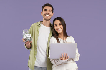 Sticker - Young couple with laptop and jar of money for car on lilac background