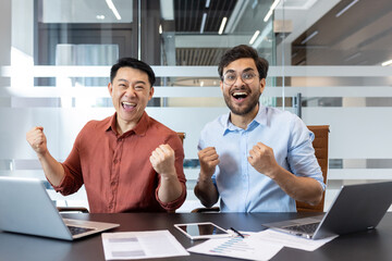 Wall Mural - Office workers celebrate success in modern workspace, expressing joy and enthusiasm. Colleagues display teamwork, achievement, and motivation, contributing to positive work environment and corporate