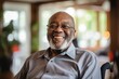 © CojanAI - Portrait of a smiling senior man in wheelchair at nursing home